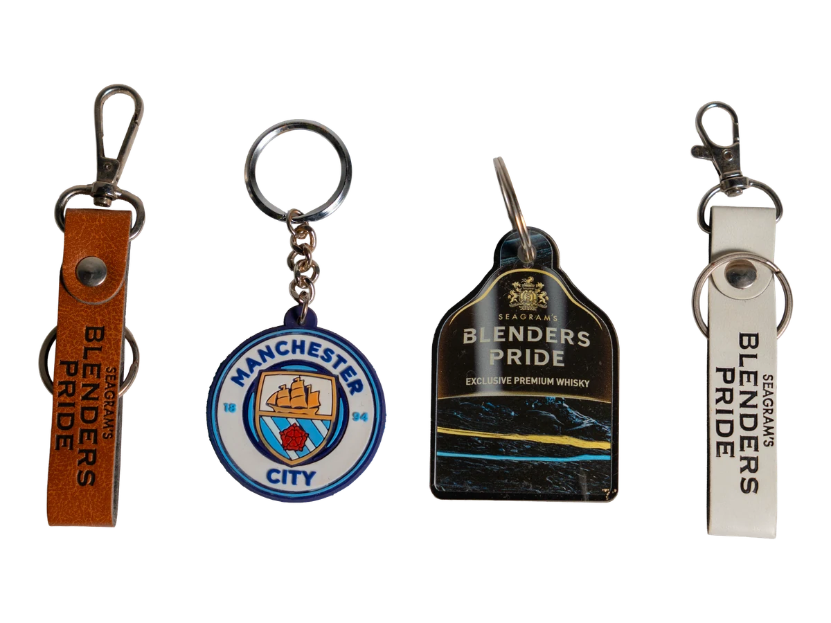 Four key rings showing different shapes and branded designs.