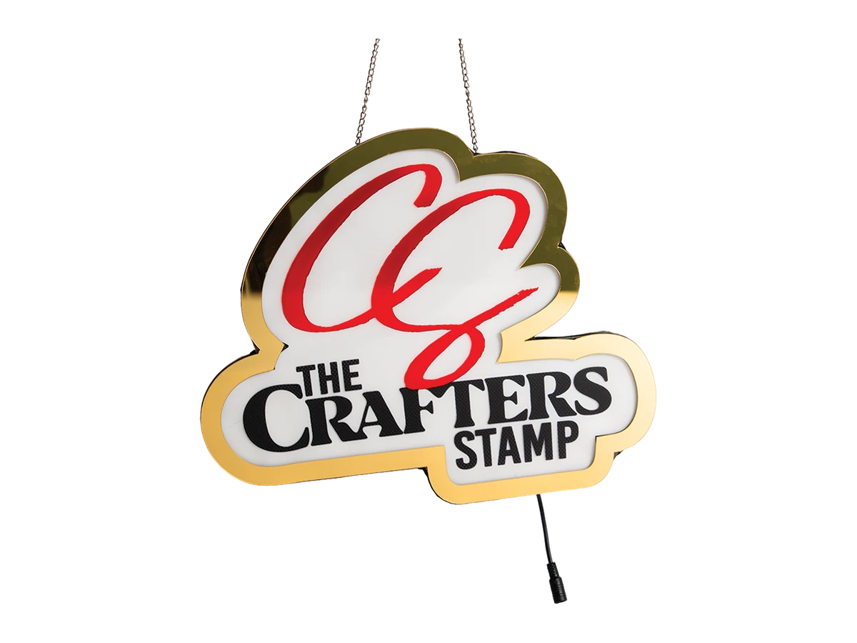 Hanging shaped retail sign with a chef-hat outline and printed branding.